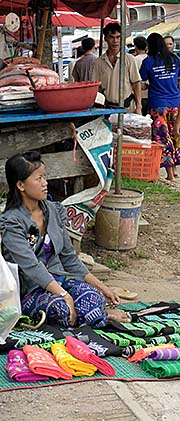 'A Tribal Girl selling Clothes on the Friday Market in Chiang Khong' by Asienreisender